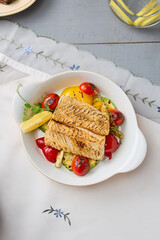 Grilled Cod Fillet with Tomatoes and Zucchini in Rustic Light