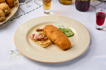 Elegant Presentation of Chicken Kiev with Toast and Bacon on a Delicate Floral Table Setting
