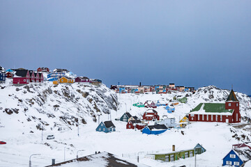 Sisimiut in Greenland with colorful houses in  a snow landscape © Sarah Østergaard