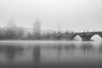 Fototapeta premium Charles bridge in Prague in fog