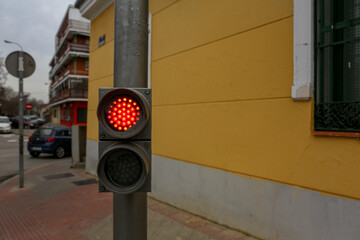 Traffic light on a street in Madrid, in its different colors and figures, whether red, green, amber...