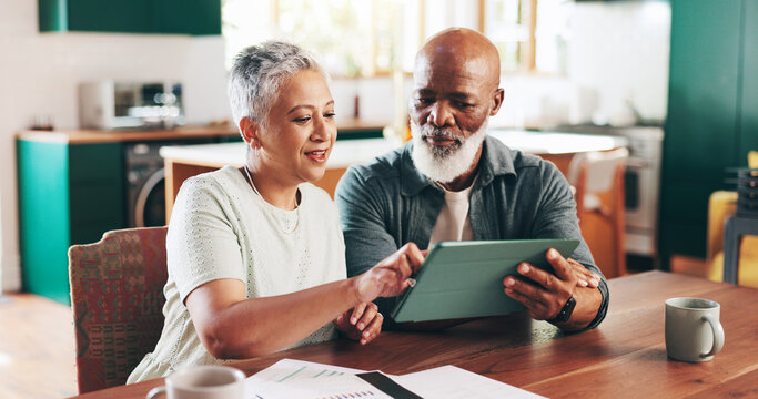 Senior couple, tablet and online for financial planning, paperwork and asset management at table. Communication, investment funding and website for taxes invoice, paying bills and wireless expenses