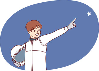 Boy astronaut points finger at star and holds spacesuit in hands for flight into space, dreaming of becoming member of spaceship crew. Child astronaut dreams of being like cosmonauts flying into orbit