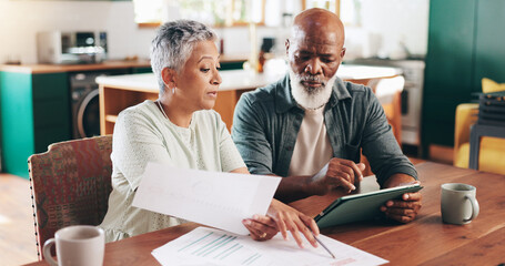 Mature, interracial couple and documents with tablet for payment due, financial planning or...