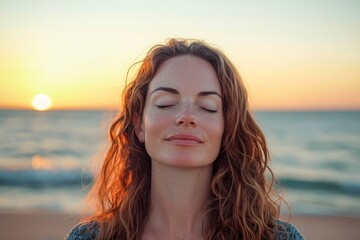 Person meditating on beach at sunset, blank background.