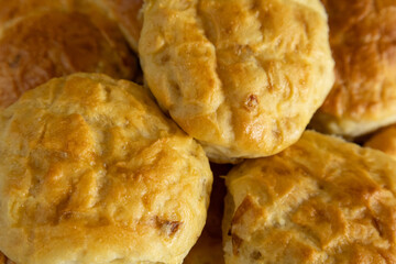Homemade golden brown scones, close-up.
