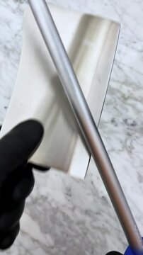 sharpening a cleaver with precision using a sharpener