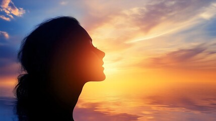 silhouette of a woman looking at a stunning sunset sky