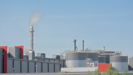  Silos` and chimneys of a factory building in the harbour of Ghent, Flanders, Belgium 
