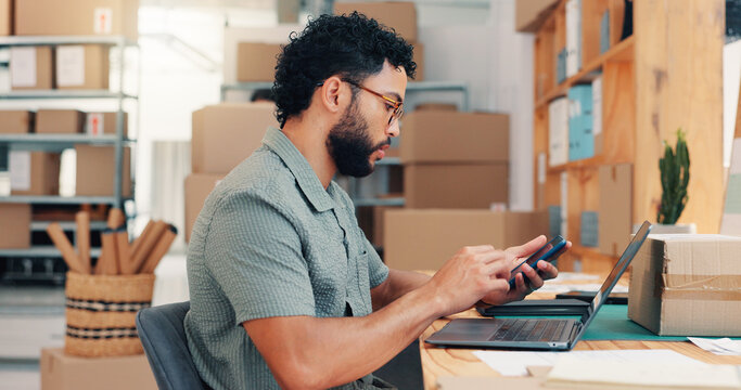 Businessman, laptop or logistics with phone for online distribution, delivery schedule or notification at warehouse. Man, employee or distributor on mobile smartphone or computer for supply chain app