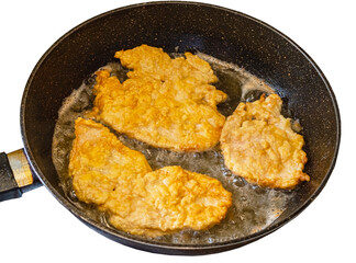 The cooking process in a pan of fried chop in batter.