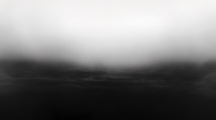 Fototapeta premium Soft grey and black abstract gradient with blurred edges, glowing gently, creating a moody and mysterious aesthetic