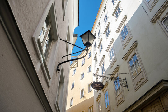 Salzburg, Austria - February 5, 2025. Picturesque Steingasse Lane, the oldest narrow street on the right side of Salzburg's old town. 