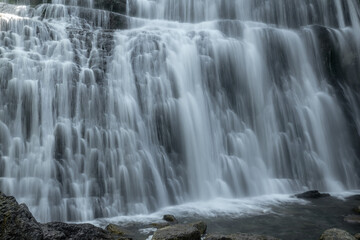 Fototapeta premium Cascade de l' éventail ,Cascades du Hérisson dans le Jura à Bonlieu au printemps , France