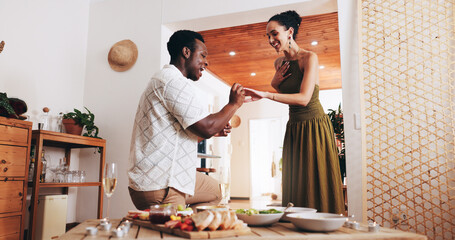 Happy, interracial couple and marriage proposal with ring for date, valentines day or romance at...