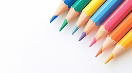 Colorful wooden pencils arranged on white background close up