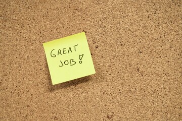 Yellow Sticky Note with "Great Job!" Written on Corkboard