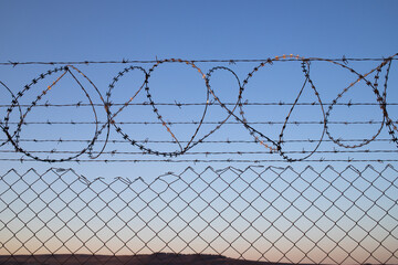 barbed wire fence no tresspassing