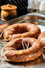 two Krakow sausages are lying on a tray