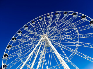 Ferris wheel with cabins against the sky. Amusement park, amusement park.