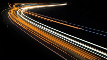 orange car lights at night. long exposure