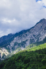Obraz premium mountain landscape in summer in swiss alps with clear sky and blue light on rocky peaks
