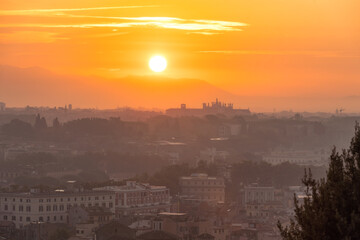 Vibrant sunrise over the city of Rome seen from the Terrazza del Gianicolo and Piazzale Giuseppe Garibaldi. Cityscape of the Capital of Italy