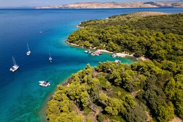 Island Sveti Grgur, Croatia, Adriatic Sea. Aerial view of beautiful  lagoon with yachts and crystal turquoise sea.