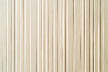 Obraz premium Beige vertical ribbed textured surface background.