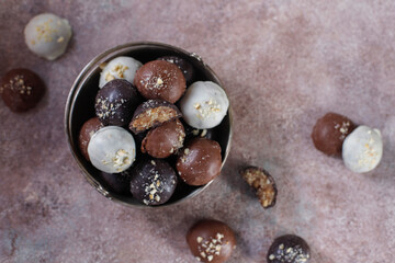 Handmade chocolate with pistachios, dark and milk chocolate pieces.