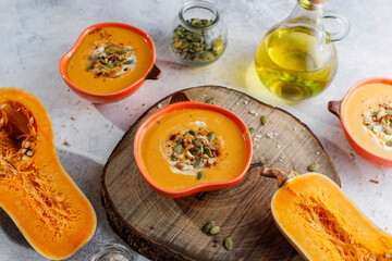 Traditional autumn butternut squash soup with seeds.