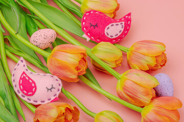 Gentle Easter composition with tulips flowers and handmade felt birds. Traditional elements