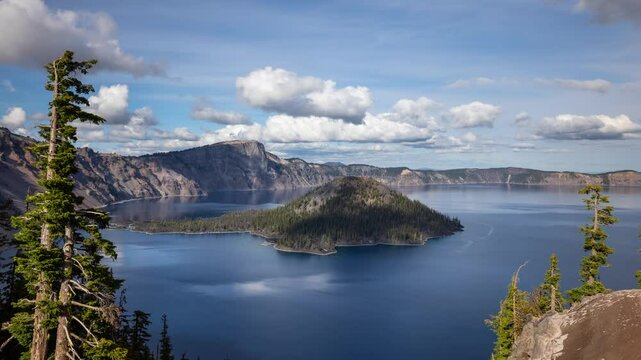 Time lapse of puffy clouds moving across the sky above Crater Lake in Oregon