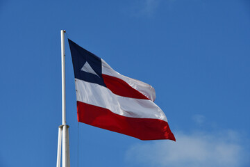Beautiful flag of the state of Bahia on a sunny summer day with blue sky. Flag of Bahia, Brazil