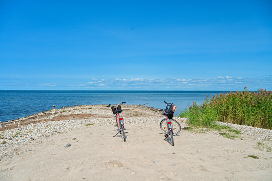 Cycling tour as a holiday excursion across Kihnu Island &ndash; Two rented bicycles stand on the island's beach overlooking the Baltic Sea under a blue summer sky, Kihnu, P&auml;rnu, Estonia, Baltic States
