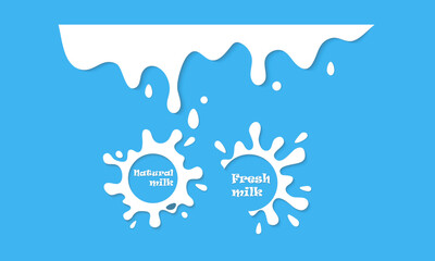 Milk drips, yogurt drips or cream on blue background