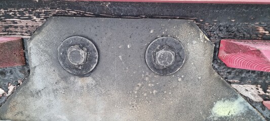 Metal bolts on foot bridge in winter with cold rime closeup