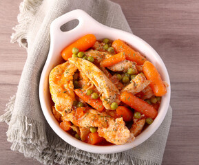 Chicken breast with carrot and peas