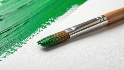Fototapeta premium Vibrant Green Brush Stroke Artwork on Canvas Close Up on White Background