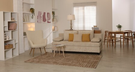 Stylish furniture and decor in cozy living room. Interior design