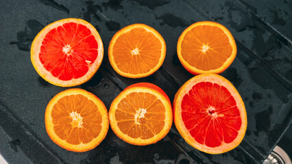 Oranges and grapefruits cut in half for squeezing in the kitchen.
