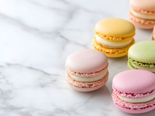 Obraz premium Assorted pastel-colored French macarons placed on a marble surface, showcasing delicate texture, elegant patisserie, and a sweet gourmet experience 
