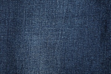 Fototapeta premium Texture of dark blue jeans as background, top view