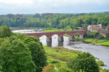 Fototapeta premium The historic Alte Windaubrücke bridge in Kuldiga, a brick arch bridge over the Venta River near Kuldiga, Courland, Latvia