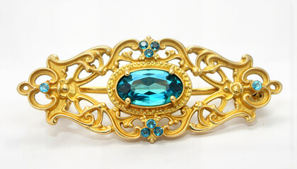 Antique gold brooch with blue topaz, vintage elegance