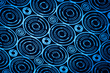 blue background with circles. texture of blue fabric with geometric patterns.	