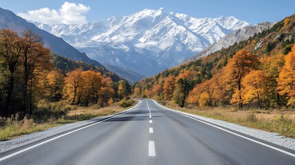 Fototapeta premium A quiet, winding road along a river in the valley between towering mountains, with snow gently falling from the sky.