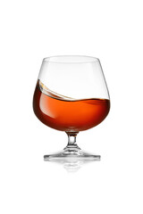 Glass of cognac or brandy with splash isolated on white background