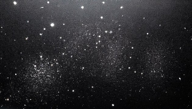 dust flecks on black metal surface