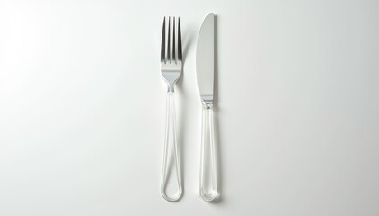 Transparent plastic fork and knife mockup placed on a smooth white background with soft shadows, emphasizing the lightweight and disposable nature with copy space